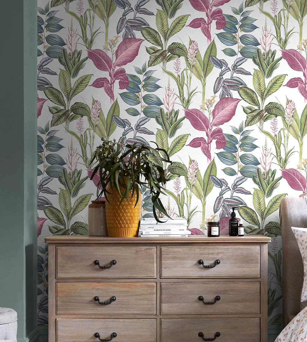 Next Fantasy Rainforest Leaves Wallpaper in a bedroom with chest of drawers